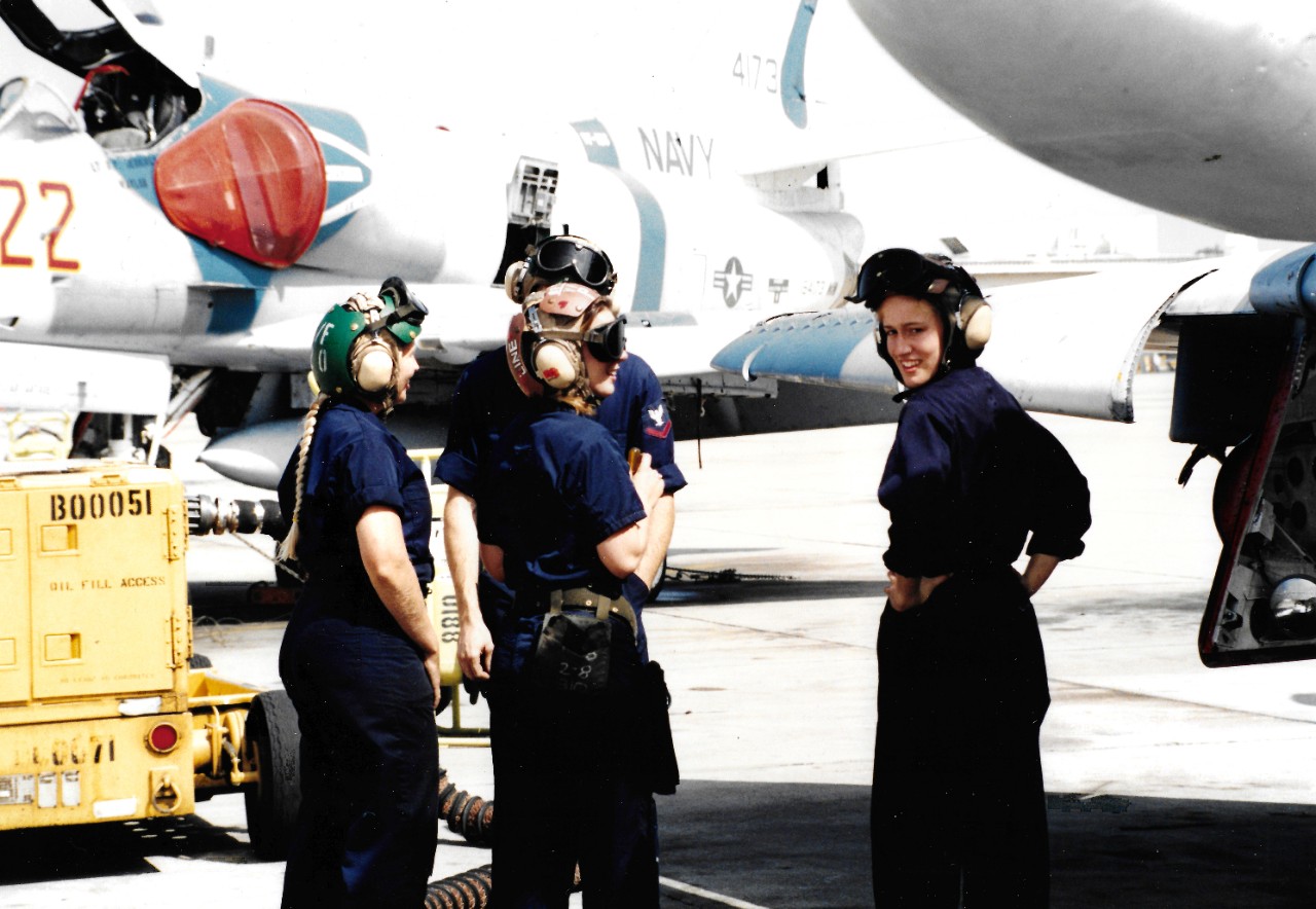 330-CFD-DN-SC-95-00031:   Female Plane Captains, November 1994.  Plane captains for Fighter Squadron 126 (VF-126) prepare for preflight checks on the TA-4J Skyhawk aircraft.   Photographed by PH3 Jason Marzini, November 24, 1994.   Official U.S. Navy Photograph, now in the collections of the National Archives.  