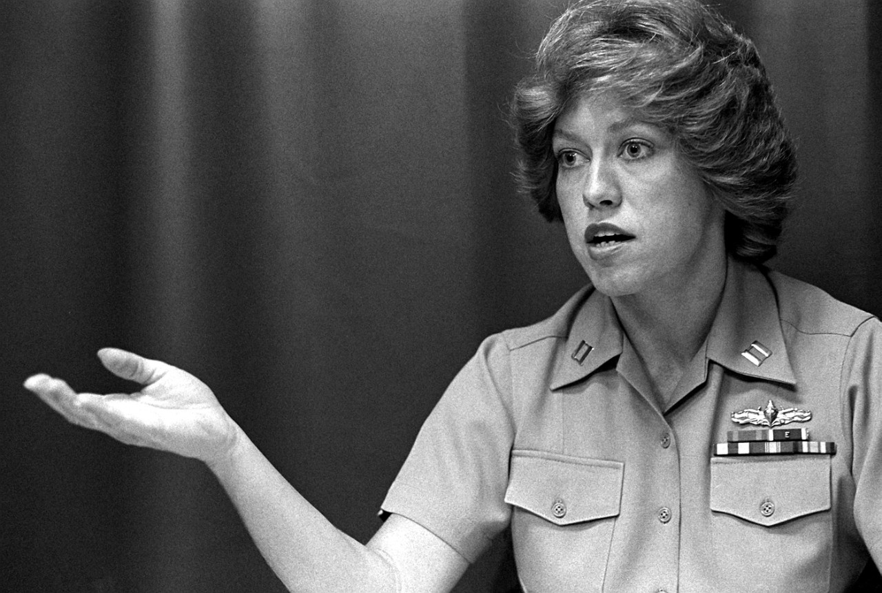 330-CFD-DN-SN-82-03606:   Lieutenant Billie E. Crawford, USN, 1981.   This candid shot shows Crawford, who was the first woman to become Surface Warfare Officer qualified, onboard USS Jason (AR-8).   She was also qualified to be Officer-of-the-Deck (OOD) and Command Duty Officer (CDO).  Photographed in 1982 by PH2 Norris Brown, Jr.   Official U.S. Navy photograph, now in the collections of the National Archives.  