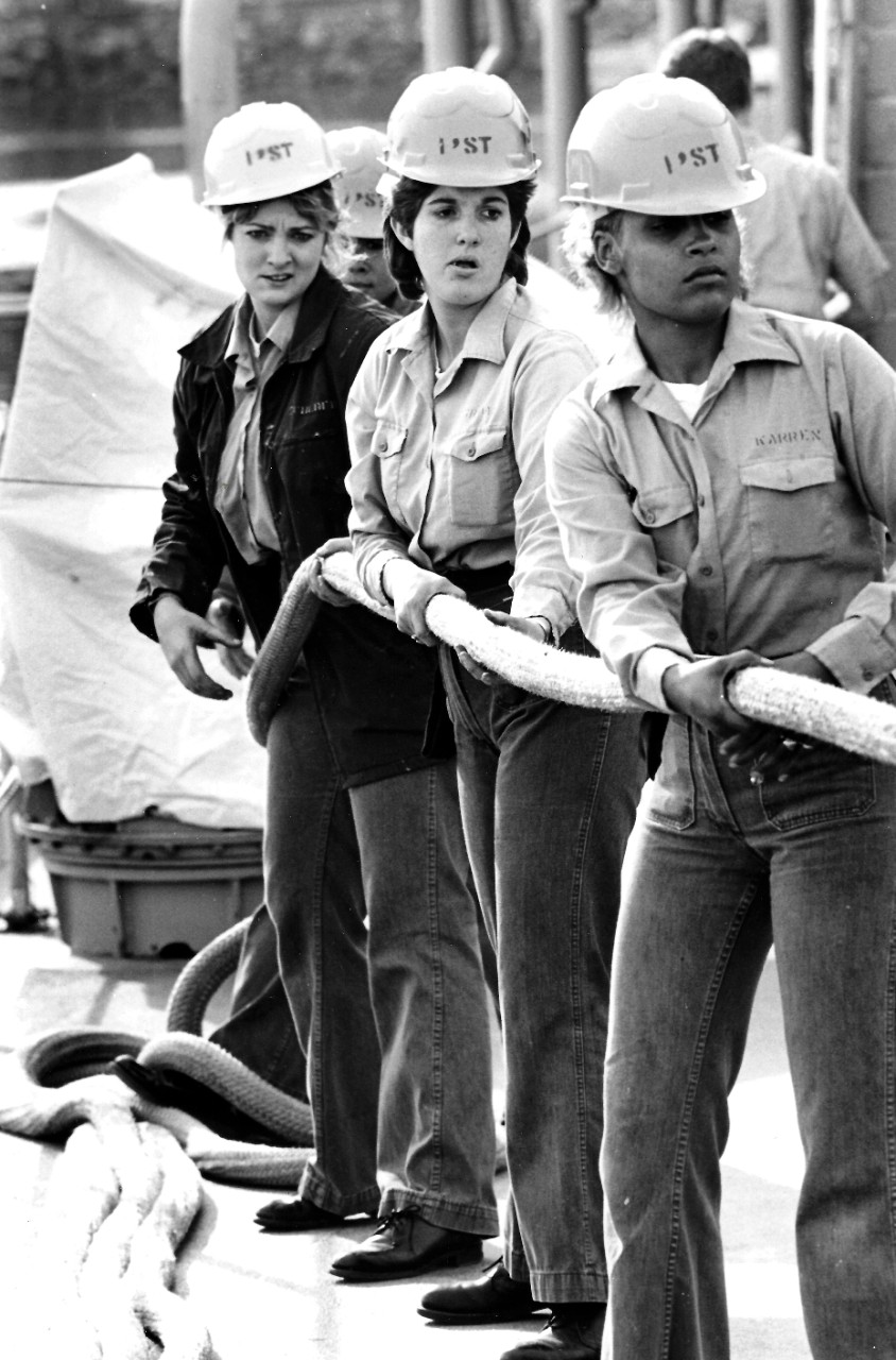330-CFD-DN-SN-88-06096:   Female Sailors from USS McKee (AS-41), February 1988.   The Sailors haul rigging lines aboard the submarine tender.  Approximately 350 women are currently part of the ship’s 1,250 member crew.   Photographed by Dave Fraker, USNR, (Retired).   Official U.S. Navy photograph, now in the collections of the National Archives.  