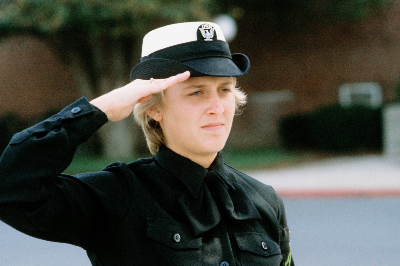 330-CFD-DN-ST-85-08963:   Photographer's Mate Airman Tina Brown, 1985.   Brown salutes during morning colors at the Naval Audiovisual Center, Naval Station Anacostia. Official U.S. Navy photograph, now in the collections of the National Archives.  