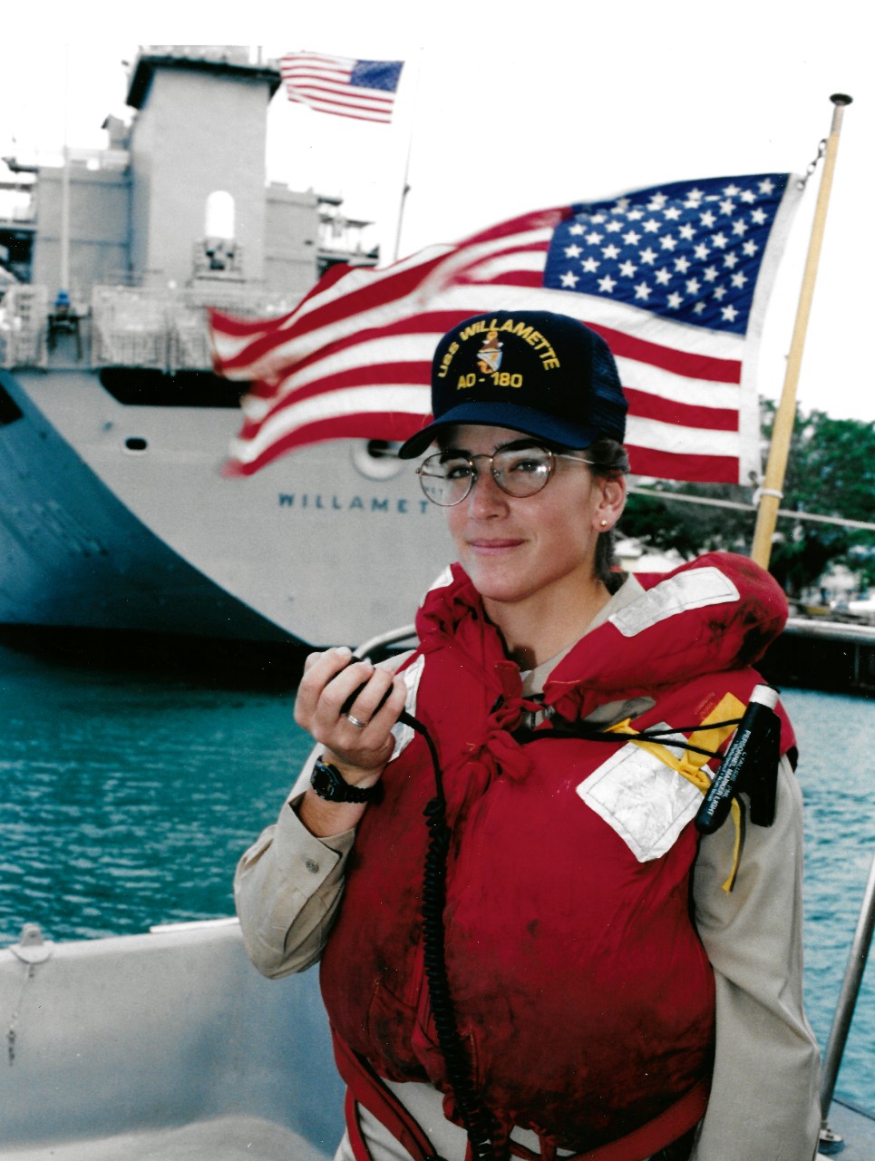 NMUSN-17:   Ensign Julia Lopez, Deck Division Officer, 1994.  Lopez makes preparations to get the Cimarron-class oiler USS Williamette (AO-180) underway from Pearl Harbor, Hawaii.   Photographed by PH2 Stephen Grzezdzinski, December 6, 1994.   Official U.S. Navy Photograph.   National Museum of the U.S. Navy Photograph Collection. 