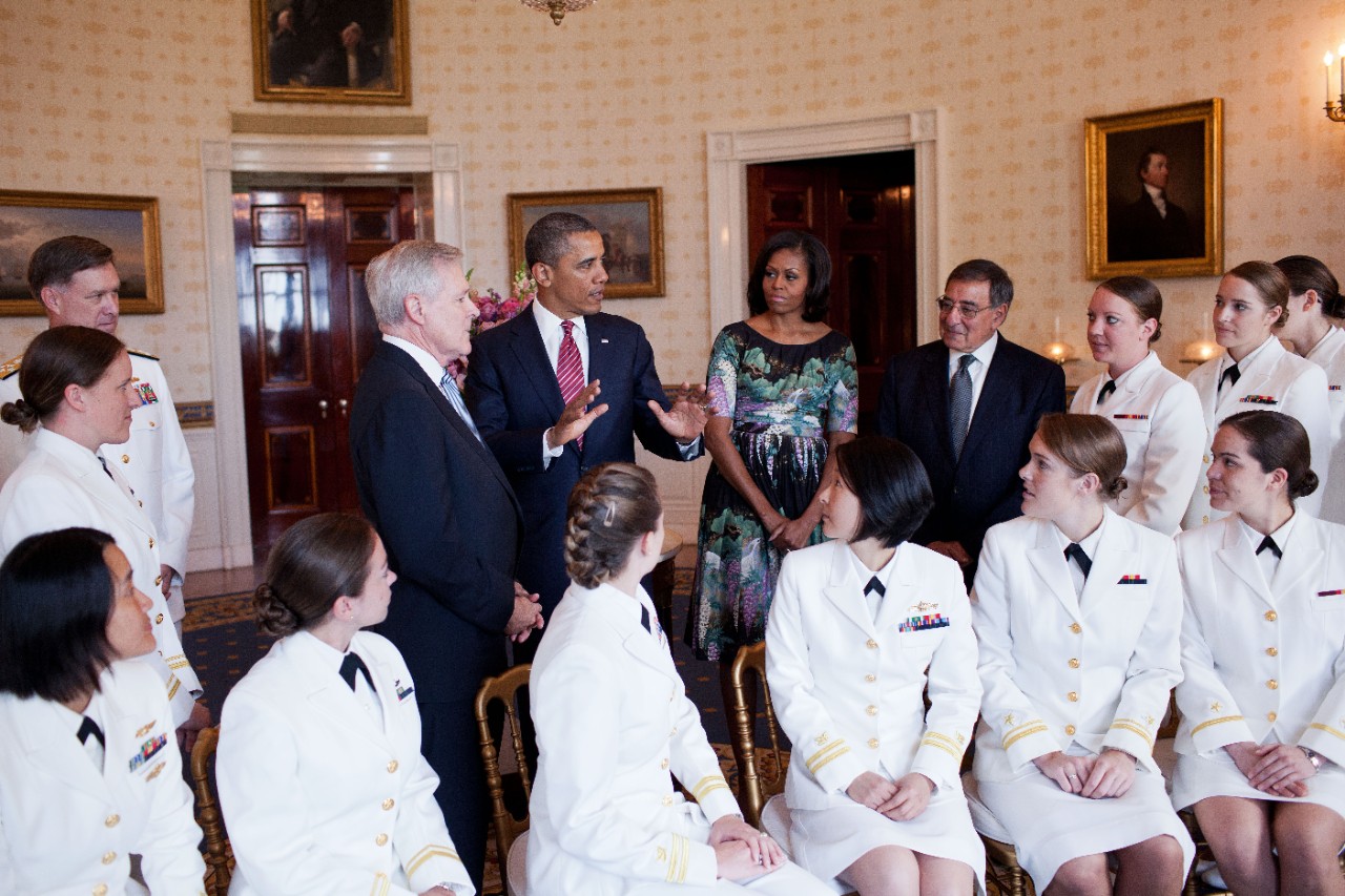 176548844:   First U.S. Navy Submariners, 2012.  President Barack Obama and First Lady Michelle Obama greet the U.S. Navy’s first contingent of women submariners to be assigned to the Navy’s operational submarine force, in the Blue Room of the White House, May 28, 2012.   The 24 women were accepted into the Navy’s nuclear submarine program after completing an intensive training program and serve on ballistic and guided-missile submarines throughout the Navy.  Also attending were Admiral Mark Ferguson, left, Navy Secretary Ray Mabus and Defense Secretary Leon Panetta, right.   Official White House Photograph, now in the collections of the National Archives. 