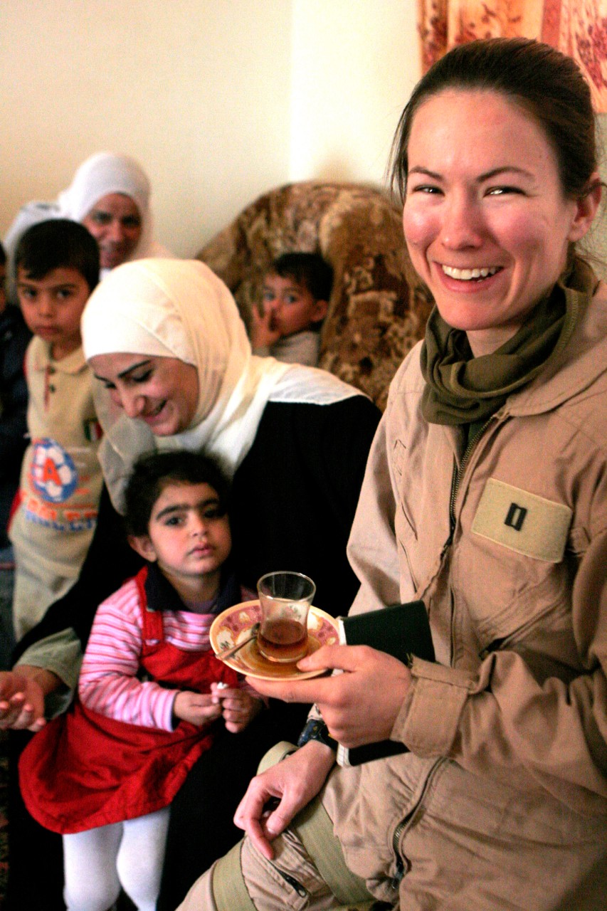 330-CFD-DM-SD-07-27768:  Lieutenant Bunday Ladowicz, 2006.   Ladowicz, foreground, assigned to the Third Marine Aircraft Wing Forward, enjoys a cup of tea during an Iraqi Woman’s Engagement meeting, held in Baghdad, Iraq, on November 28, 2006, to discuss issues and concerns the women have in their community.  The aircraft wing is deployed with First Marine Expeditionary Force in support of the global war on terrorism in the Al Anbar Province of Iraq.   Photographed  on November 28, 2006 by Gunnery Sergeant Michael Q. Retana.  Official U.S. Marine Corps Photograph. 