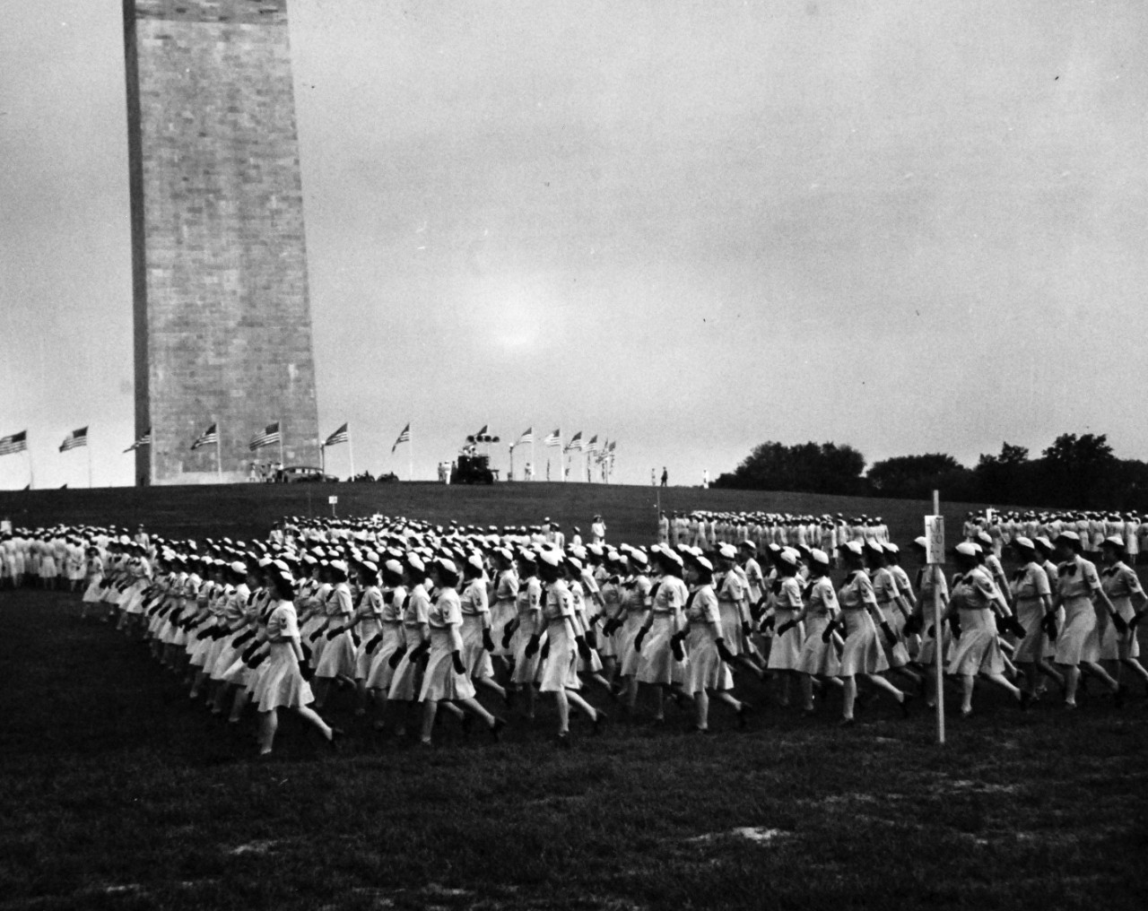 80-G-46257:  WAVES in Washington, D.C., July 1944.  WAVES  hold rally at Washington Monument Grounds to celebrate the second anniversary of the establishment of the Women’s Reserve of the U.S. Navy.  From all over the District of Columbia, companies of WAVES comes in precise formations to take their places for the rally.  Released July 31, 1944.  Official U.S. Navy Photograph, now in the collections of the National Archives.  