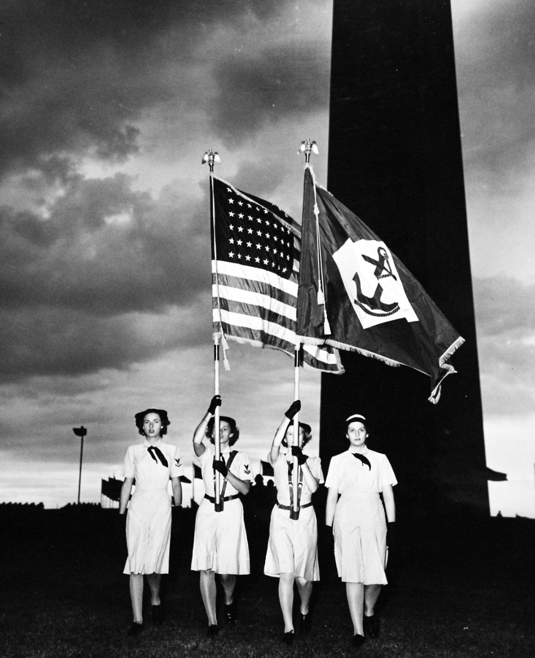 80-G-46262:  WAVES in Washington, D.C.,  July 1944.  WAVES hold rally at Washington Monument Grounds to celebrate the second anniversary of the establishment of the Women’s Reserve of the U.S. Navy.  The color guard leads the procession.  Released July 31, 1944.  Official U.S. Navy Photograph, now in the collections of the National Archives.   