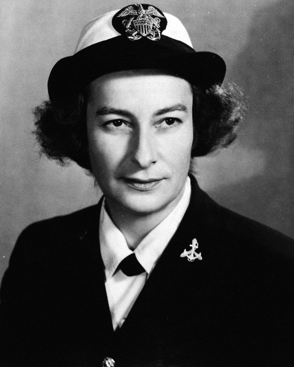 80-G-43277:  Service Dress Blue, June 1943.    Lieutenant Junior Grade Jenny Turnbull, USNR (W).    U.S. Navy photograph, now in the collections of the National Archives.  