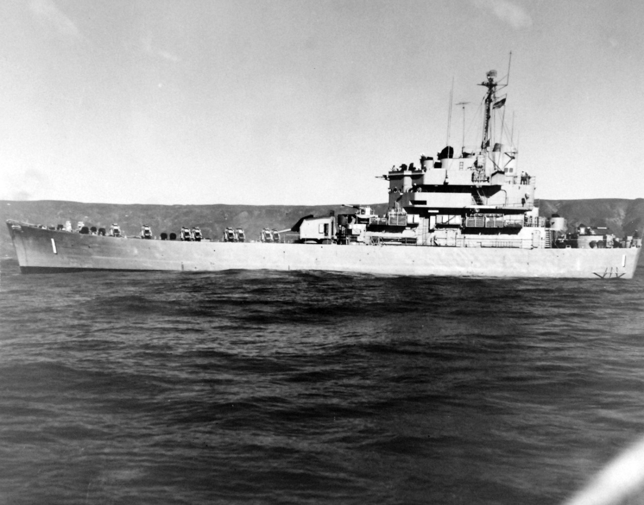 80-G-689756:  USS Carronade (IFS-1), 1955-59.  Carronade was an Inshore Fire Support Ship, built to provide gunfire support to amphibious landings or operations close to shore. Official U.S. Navy Photograph, now in the collections of the National Archives.  (2017/11/01).  Photograph is extremely curved.  