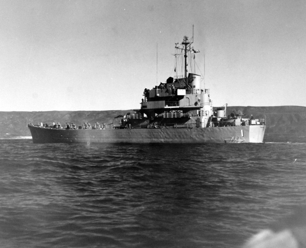 80-G-689758:  USS Carronade (IFS-1), 1955-59.  Carronade was an Inshore Fire Support Ship, built to provide gunfire support to amphibious landings or operations close to shore. Official U.S. Navy Photograph, now in the collections of the National Archives.  (2017/11/01).  Photograph is extremely curved.  