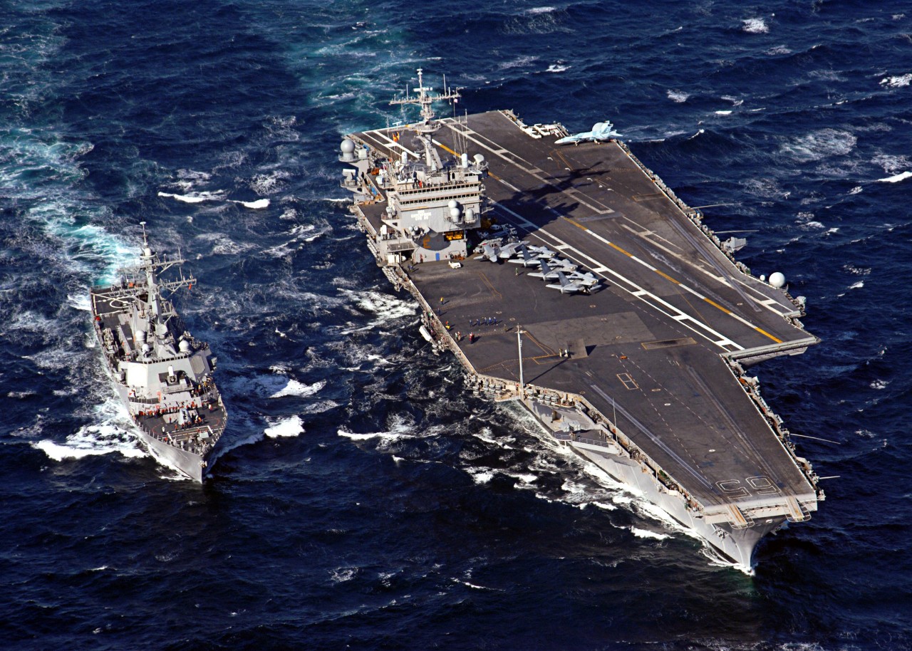060206-N-7748K-002:  USS Enterprise (CVN-65), 2006. The guided-missile destroyer USS McFaul (DDG-74) steams alongside the nuclear-powered aircraft carrier USS Enterprise (CVN-65) for a refueling at sea, February 6, 2006.  Officia08l US Navy photo byPhotographer's Mate 3rd Class Josh Kinter.   Official U.S. Navy Photograph.      