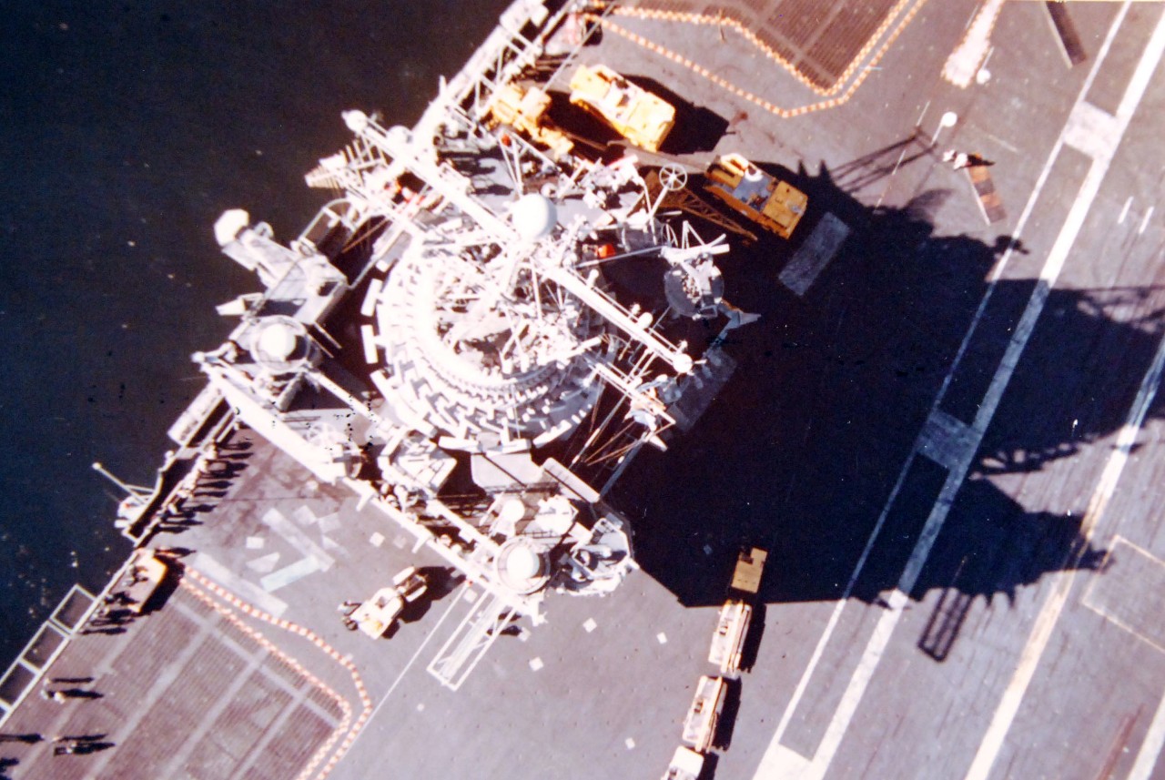 428-GX-K-112736:  USS Enterprise (CVN-65), 1976.   An overhead view of the island of the nuclear-powered aircraft carrier as she is preparing to dock at Naval Air Station, North Island, San Deigo, California.  Photographed by PH2 Robert Chouinard, January 23, 1976.  Official U.S. Navy Photograph, now in the collections of the National Archives.  (2017/11/29).  