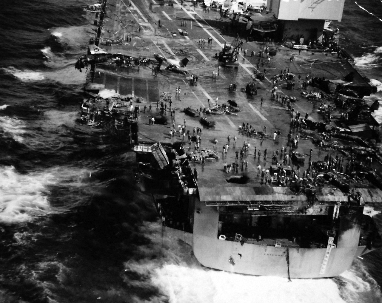 428-GX-KN-17590:    USS Enterprise (CVAN-65), January 1969.     Pacific Ocean.  Fire damage on board the flight deck of USS Enterprise (CVAN-65).  The aircraft was destroyed as the ship was conducting air operations 75 miles south of Pearl Harbor.   Photographed by PH2 Stanley C. Wyckoff, January 14, 1969.       Official U.S. Navy photograph, now in the collections of the National Archives.   (2016/07/26).