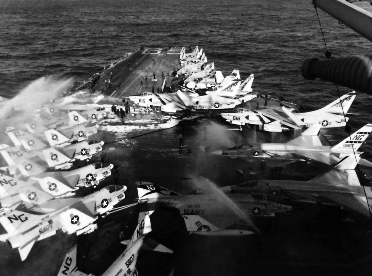 428-GX-USN-1140830:    USS Enterprise (CVAN-65), January 1969.     Pacific Ocean.  Sprinkler systems operate on the forward part of the flight deck of USS Enterprise (CVN 65) during a fire which broke out as the ship was conducting air operations 75 miles south of Pearl Harbor.   Photographed by PH2 Lawrence T. Henderson, January 14, 1969.       Official U.S. Navy photograph, now in the collections of the National Archives.   (2016/07/26).