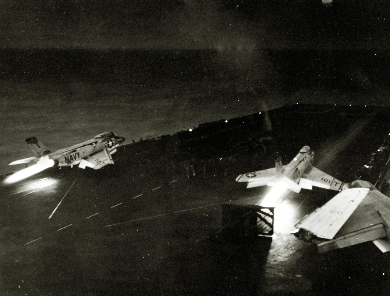 330-PS-8499 (USN 1017244):     USS Forrestal (CVA-59), 1957.     Ready for take-off, two McDonnell F3H “Demon” aircraft are catapulted from the aircraft deck of USS Forrestal (CVA-59) for night interception training mission in the Eastern Mediterranean.   Photograph released July 19, 1957.   Official U.S. Navy Photograph, now in the collections of the National Archives.   (2014/12/30). 