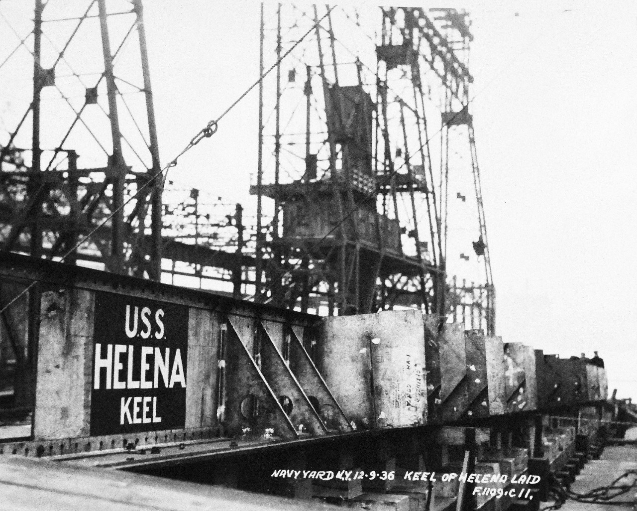 19-LC-23174:  USS Helena (CL-50), December 1936.    The cruiser is at the New York (also known as Brooklyn) Navy Yard, New York City, New York, showing the keel being laid, December 9, 1936.    Official Bureau of Ships Photograph, now in the collections of the National Archives.   (2015/2/18). 