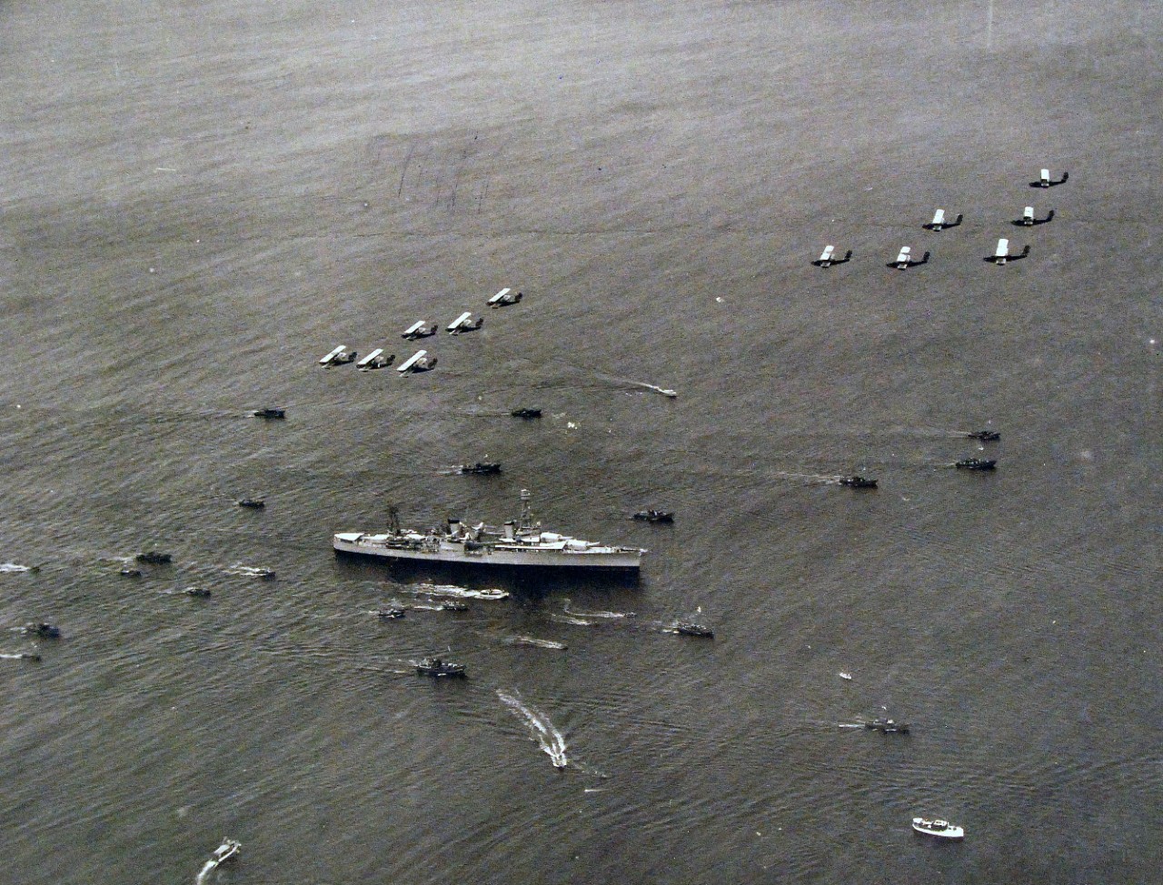 <p>80-CF-393-28: Aerial view of USS Houston (CA 30), with President Franklin D. Roosevelt on board, arriving at Fleet Air Base, Pearl Harbor, Territory of Hawaii, July 25, 1934.&nbsp;</p>
