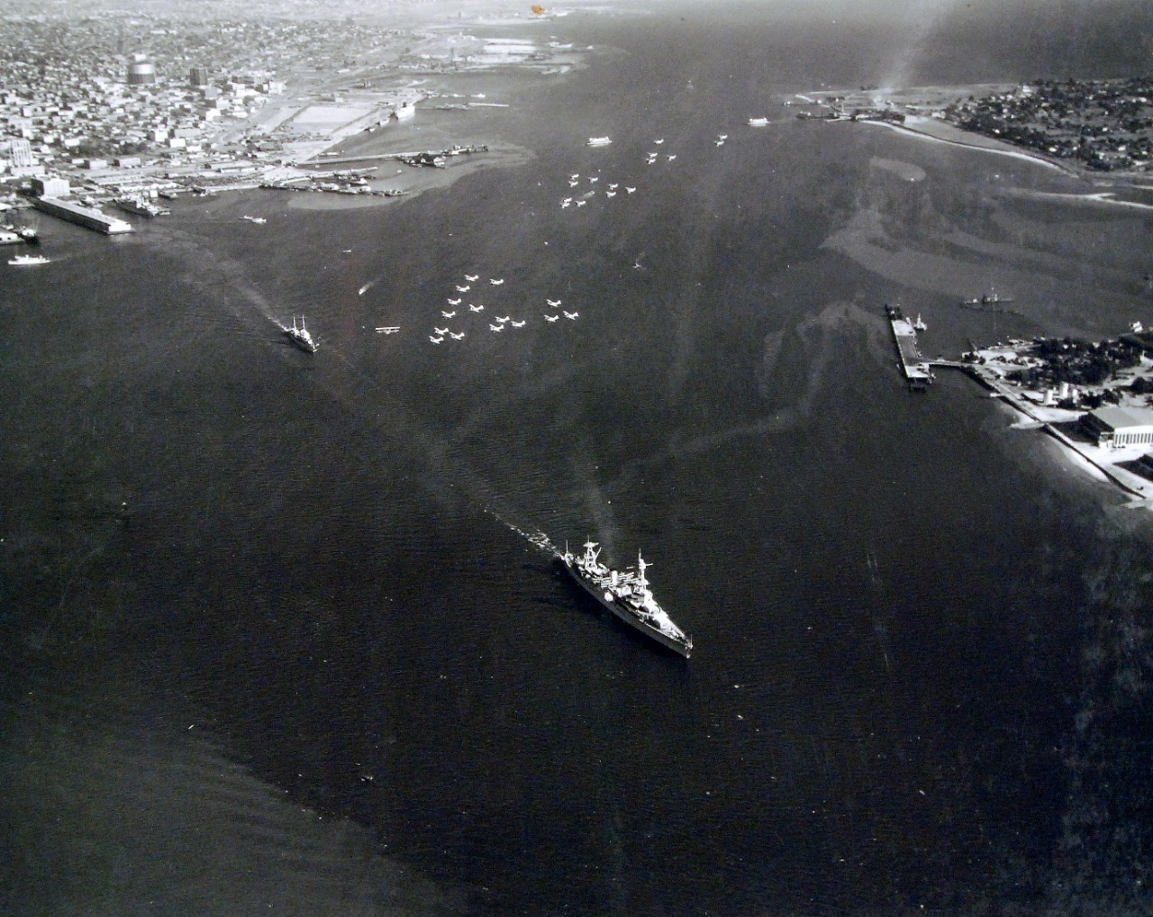 <p>80-CF-393-3: USS Houston (CA 30) leaving San Diego, California, with President Franklin D. Roosevelt and Admiral J.M. Reeves, Commander in Chief, U.S. Fleet on board to review fleet maneuvers at sea, October 2, 1935.&nbsp;</p>
