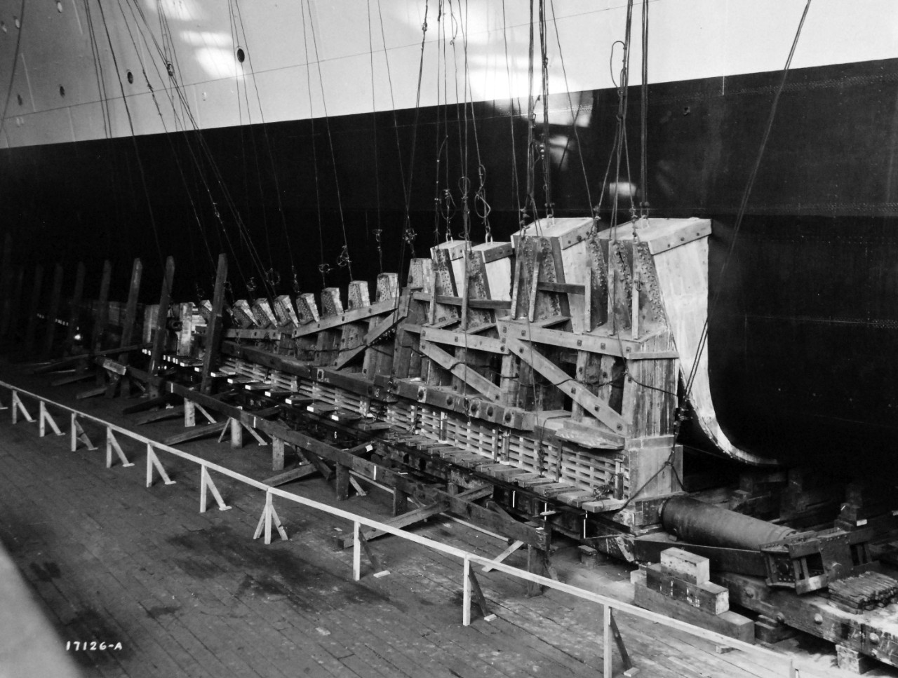 19-LC-61836c:    USS Indianapolis (CA-35), 1931.   Forward packing at the launching at the New York Shipbuilding Corporation, November 7, 1931.   Indianapolis was commissioned on November 15, 1932 and was later sunk during World War II by Japanese submarine I-58 on July 30, 1945.    Official U.S. Navy Photograph, now in the collections of the National Archives.   (2015/2/3).   