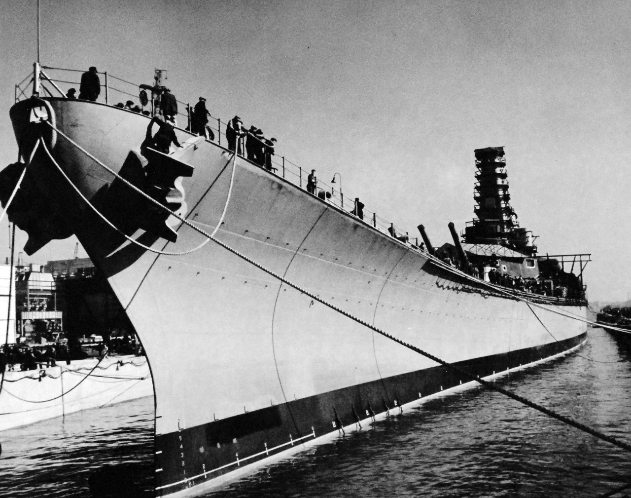 80-G-13555:   USS Iowa (BB 61), 1942.   USS Iowa leaves the New York Navy Yard for completion at the specially built Naval Supply Base, Bayonne, New Jersey, October 20, 1942.  The hull is secured in drydock.  Photograph released by Public Relations, Third Naval District.    Official U.S. Navy Photograph, now in the collections of the National Archives.  (2016/08/09)
