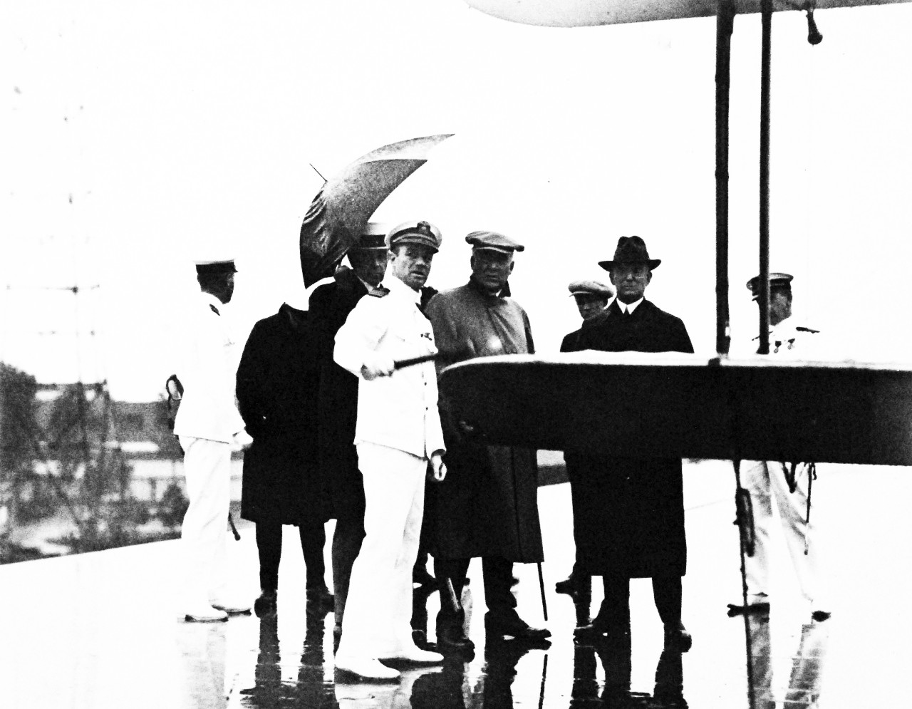 80-G-433311:  USS Langley (CV-1), 1922-23.  President Warren G. Harding, with Commander Kenneth Whiting, USN, Secretary of the Interior Hubert Work, and Rear Admiral William A. Moffett, USN, on the flight deck of USS Langley (CV 1), 1922-23.   Photograph received October 2, 1951.   Official U.S. Navy Photograph, now in the collections of the National Archives.  (2016/12/20).
