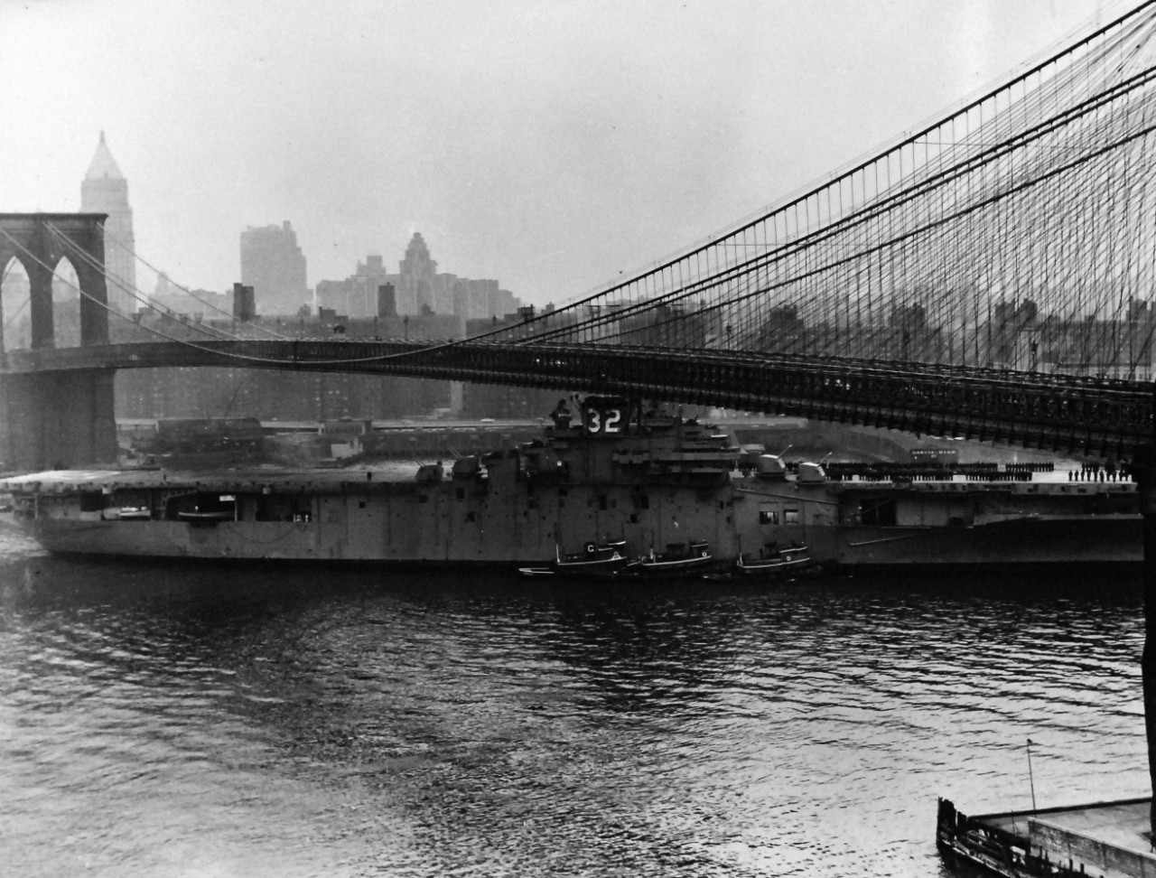 80-G-686302:   USS Leyte (CVS-32), squeezing under the Brooklyn Bridge.  Radar antennae and mast had to be removed, 19 February 1956.   Official U.S. Navy Photograph, now in the collections of the National Archives.  (2013/09/16). 