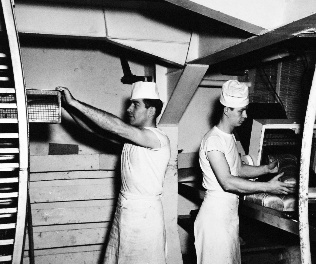 80-G-706996:   USS Leyte (CV-32), 1949.   Sailors working with the bread machine in the bake shop, released March 11, 1949. Official  U.S. Navy Photograph, now in the collections of the National Archives.  (2016/06/14).  