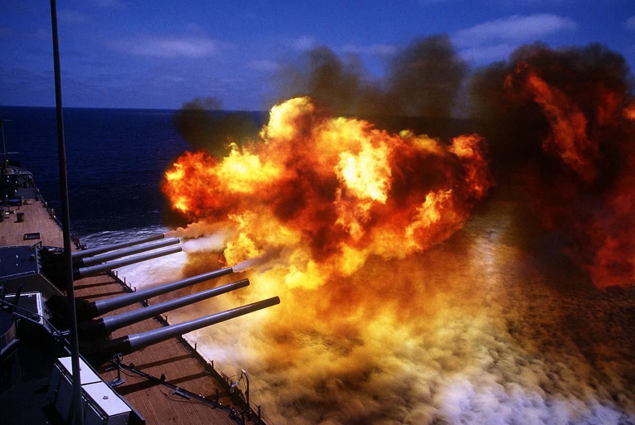 300-CFD-DN-ST-87-00674:  USS Missouri (BB-63), 1986.   The No. 1 and 2 Mark 7 16-inch/50-caliber gun turrets are fired during a main battery firing exercise aboard the battleship USS Missouri (BB-63).  The ship is en-route to Sydney, Australia, during a cruise around the world, 1986.   Official U.S. Navy Photograph, now in the collections of the U.S. National Archives - Online Public Access. 