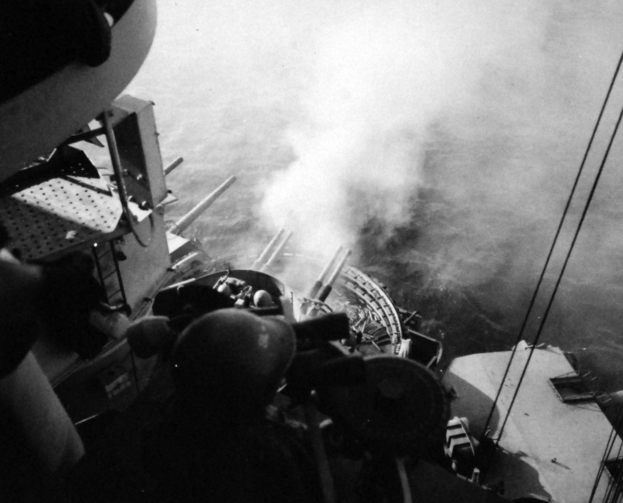 80-G-307121: Battle for Iwo Jima, February-March 1945.  Shown:  Firing into cave on Mt. Suribachi by the 40 mm guns of USS Nevada (BB-36).  Photographed by USS Nevada (BB 36), February 17, 1945.  U.S. Navy photograph, now in the collections of the National Archives.  
