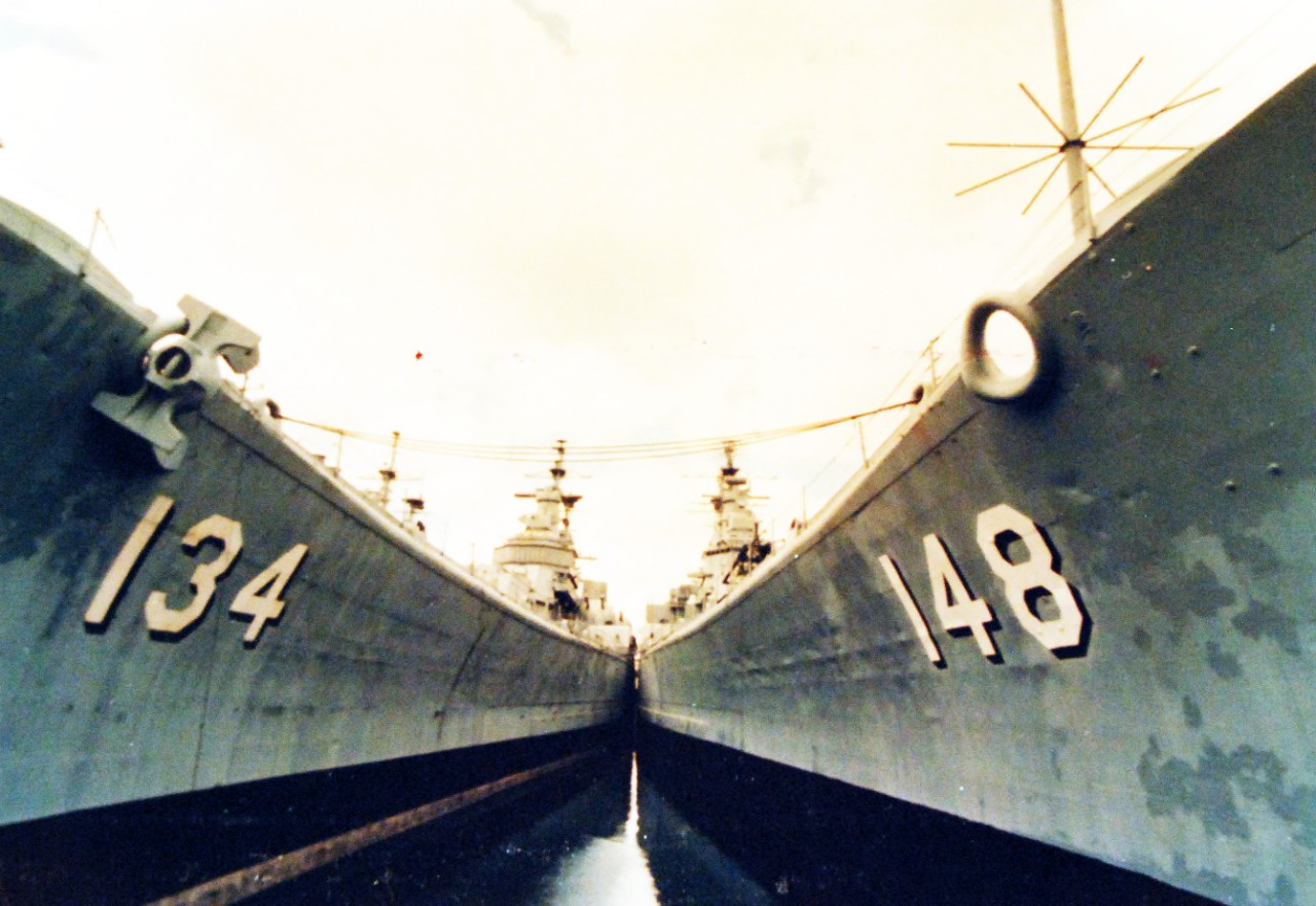 428-GX-K-117046:   Philadelphia Naval Shipyard, Pennsylvania, August 1976. Heavy cruisers USS Des Moines (CA-134) and USS Newport News (CA-148), at dockside during BiCennentennial Exhibit.  Photographed by JO1 Emmett W. Francois, USN.     Official U.S. Navy Photograph, now in the collections of the National Archives.  (2017/10/25).  