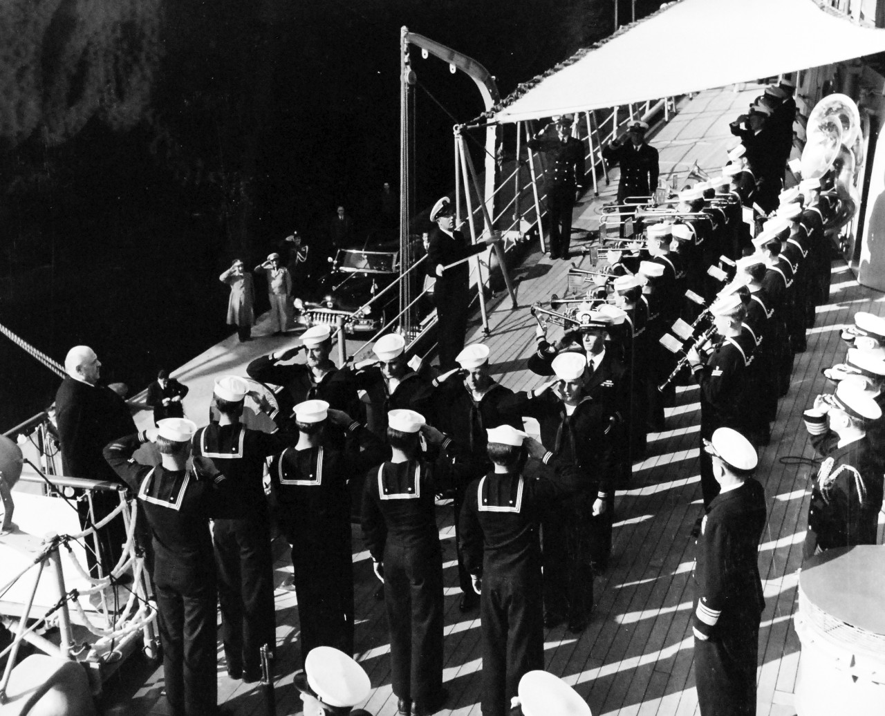 80-G-426974:   USS Newport News (CA-148), circa 1951.    President of Lebanon Bechara El Khiry on board USS Newport News (CA 148) at Beirut, Lebanon.   President El Khoury boards with band and full honors while Vice Admiral John J. Ballentine, USN, watches.       Photograph received 16 March 1951.  Official U.S. Navy Photograph, now in the collections of the National Archives.  (2014/01/30).   