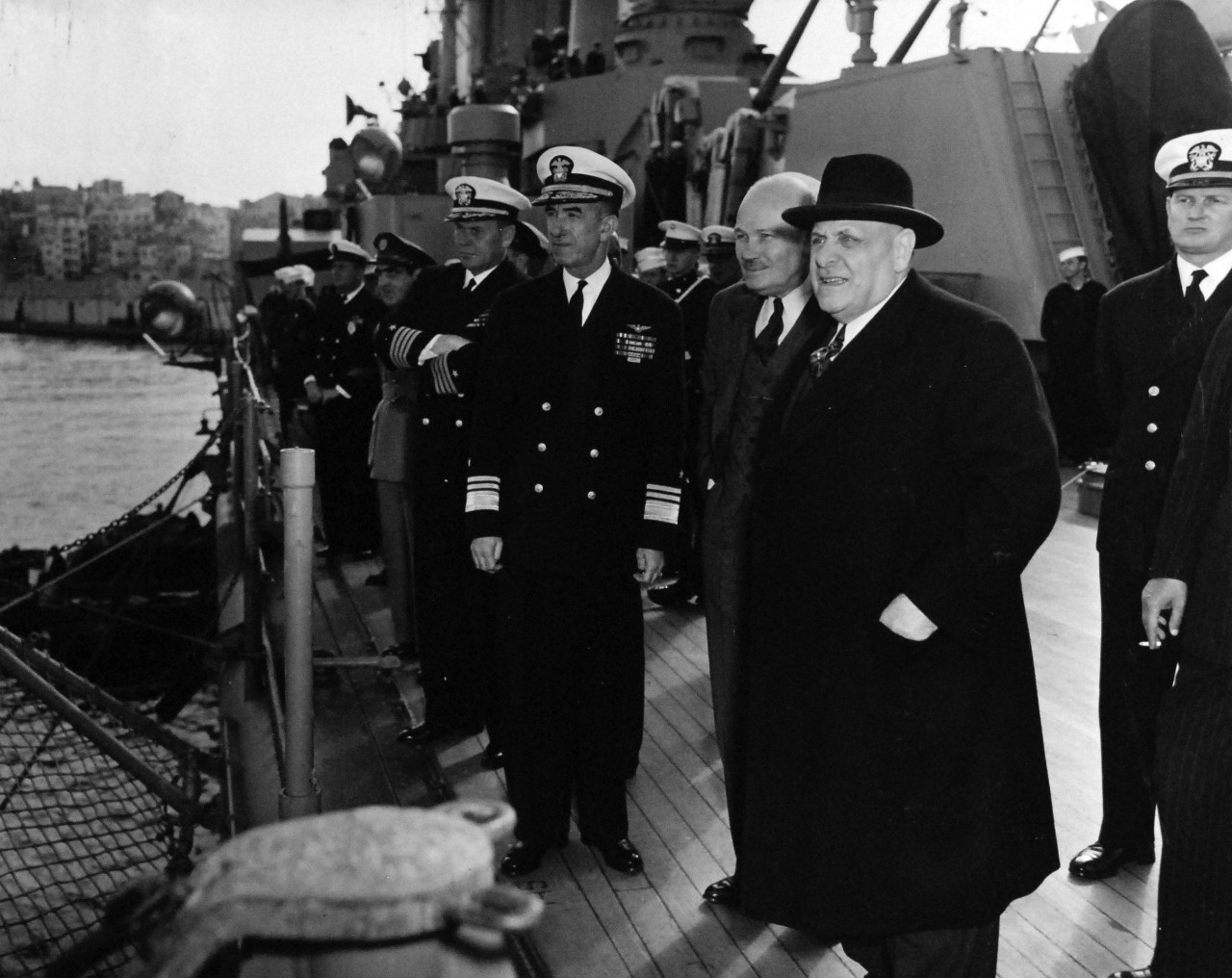 80-G-426975:   USS Newport News (CA-148), circa 1951.    President of Lebanon Bechara El Khoury on board USS Newport News (CA 148) at Beirut, Lebanon.   President El Khoury and Vice Admiral John J. Ballentine, USN, observing helicopter on fantail of the attack cruiser.   Photograph received 16 March 1951.   Official U.S. Navy Photograph, now in the collections of the National Archives.  (2014/01/30).   