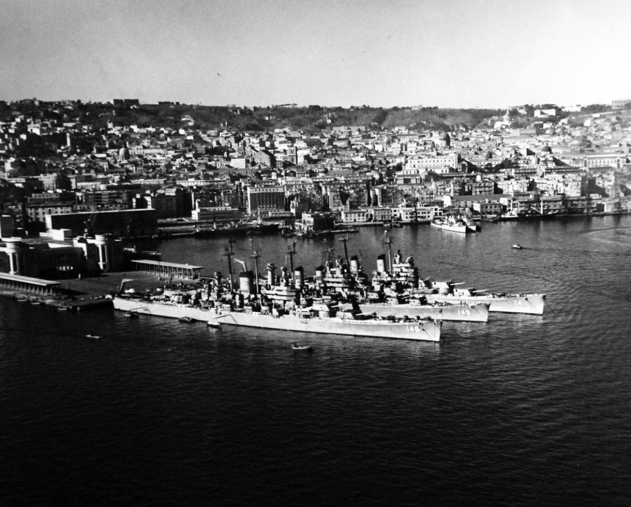 80-G-426896:   USS Newport News (CA-148), 1951.   USS Newport News (CA-148); USS Roanoke (CL-145) and USS Columbus (CA- 74) at Naples, Italy.  Photograph released February 9, 1951.  U.S. Navy Photograph, now in the collections of the National Archives.  (2016/03/22).