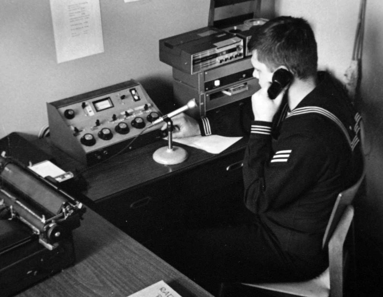 428-GX-USN-1140144:   U.S. Naval Station, San Diego, California, February 27, 1969.    A sailor at work in the command information bureau.  Information on the work of the Court of Inquiry on the capture of USS Pueblo (AGER-2) is being handled by the bureau.  Photographed by JOSN J.W. Fletcher, USN.   Official U.S. Navy Photograph, now in the collections of the National Archives (2017/05/23).  Photographed from reference card.  