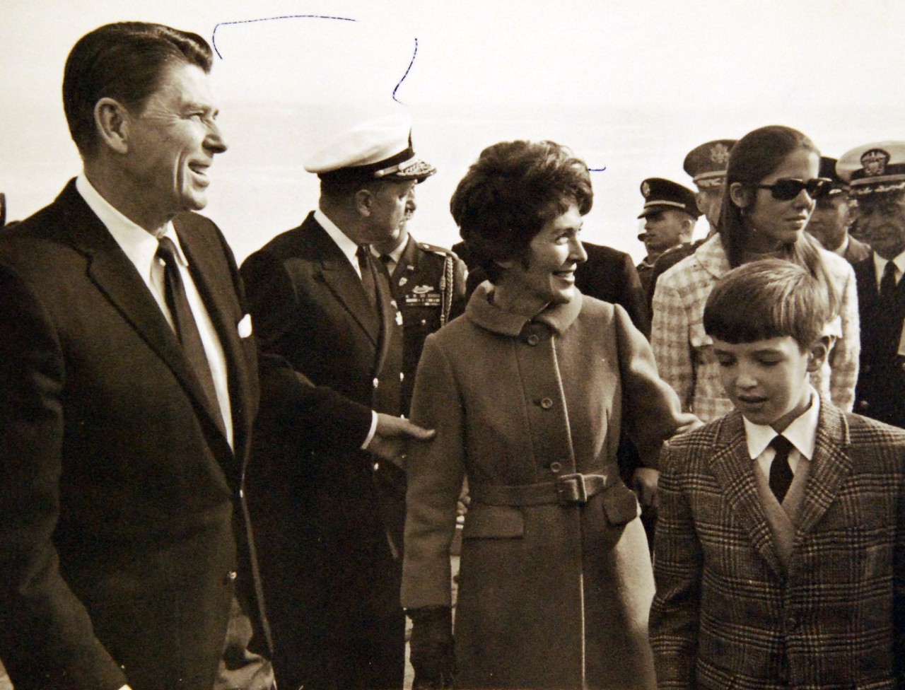428-GX-USN-1140239:   San Diego, California, December 24, 1968.   Governor Ronald Reagan of California and Mrs. Reagan mingle with members of a crowd awaiting the arrival of crewmen of USS Pueblo (AGER-2) who are flying from the Republic of Korea.  Official U.S. Navy Photograph, now in the collections of the National Archives.  (2017/05/23).  Photographed from reference card.   
