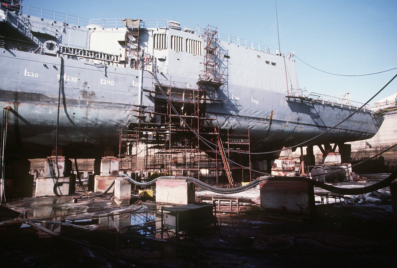 330-CFD-DN-ST-89-02266:  USS Samuel B. Roberts (FFG-58), 1988.   A view of the guided missile frigate USS Samuel B. Roberts (FFG-58) in dry dock for temporary repairs.  The frigate was damaged when it struck a mine while on patrol in the Persian Gulf, August 1.  U.S. Navy Photograph, now in the collections of the U.S. National Archives.  