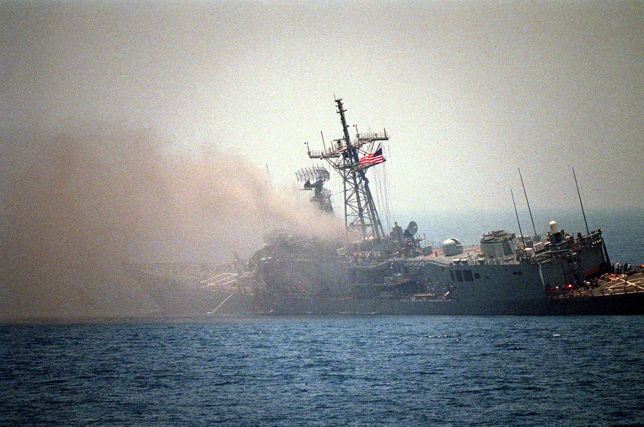 330-CFD-DN-SC-87-06414:  USS Stark (FFG-31), 1987.  A port quarter view of the guided missile frigate USS Stark (FFG-31) listing to port after being struck by an Iraqi-launched Exocet missile, May 17, 1987   U.S. Navy Photograph, now in the collections of the U.S. National Archives.  