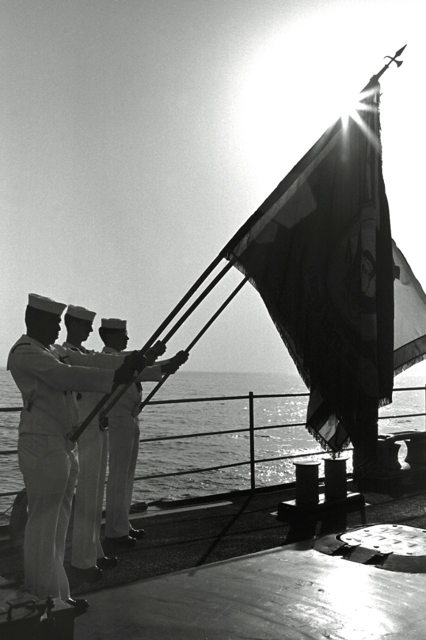 330-CFD-DN-SN-88-06478:   Wreath-Laying Memorial, 1989.    Members of the color guard stand at attention during a wreath laying memorial service aboard the destroyer USS Stump (DD-978).  The ceremony is being held to honor the 37 sailors who lost their lives when the guided missile frigate USS Stark (FFG-31) was hit by an Iraqi-launched Exocet missile exactly one year ago.   U.S. Navy Photograph, now in the collections of the U.S. National Archives.