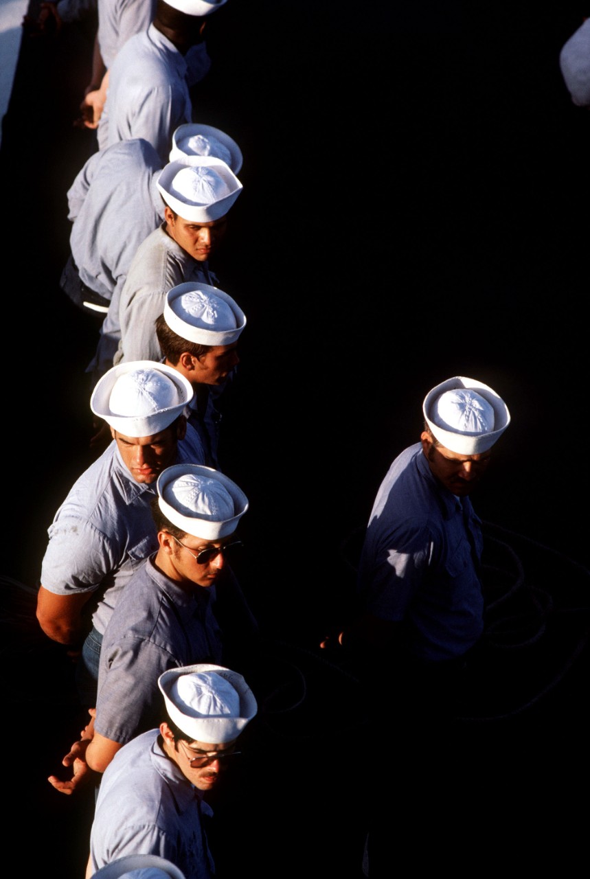 330-CFD-DN-ST-84-07549:  USS Stark (FFG-31), 1983.   Sailors stand at ease in the ranks during an inspection aboard the guided missile frigate USS Stark (FFG 31), September 15, 1983.   U.S. Navy Photograph, now in the collections of the U.S. National Archives.  