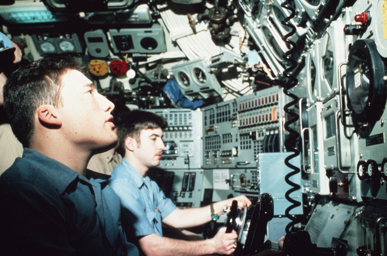 330-CFD-DN-ST-87-02303:  USS Trepang (SSN-674), 1985.  Crewmen monitor instruments aboard the nuclear-powered submarine USS Trepang (SSN-674) while underway under the ice pack during operations in support the Arctic Research and Environmental Acoustic (AREA) program. AREA '85 is a Navy-sponsored expedition to study oceanography, acoustics, geophysics, communications and submarine warfare in the polar environment, July 5, 1985.  Photographed by JOC Fred J. Klinkenberger, USN.  .    Official U.S. Navy Photograph, now in the collections of the National Archives.   