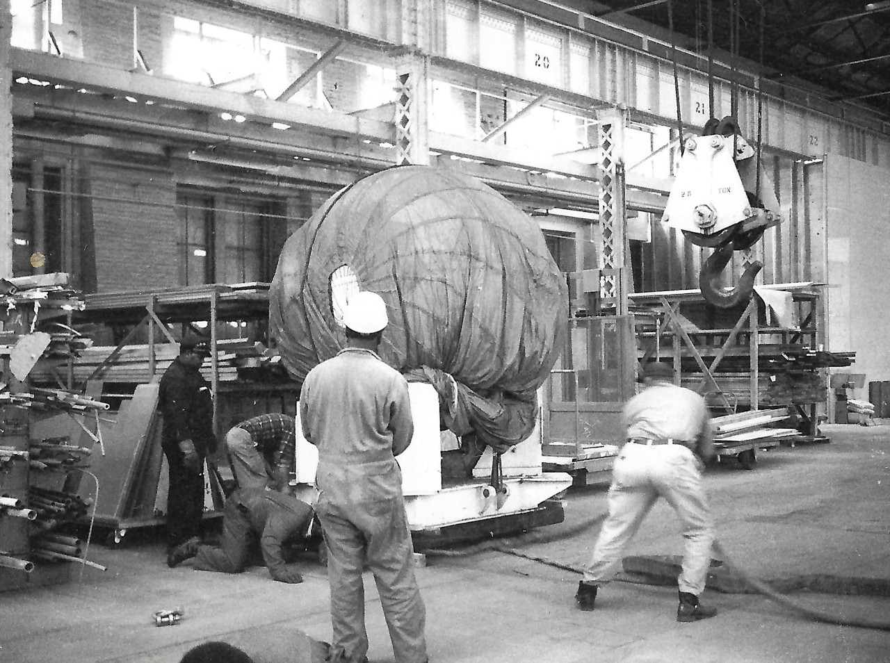 NMUSN-908:  Sphere to Bathyscaph Trieste, 1973.   The sphere to the Bathyscaph Trieste is being delivered to the Navy Memorial Museum, now National Museum of the U.S. Navy, on March 30, 1973.   This area is where the Exhibit Work Shop area now resides.  National Museum of the U.S. Navy Photograph Collection.   