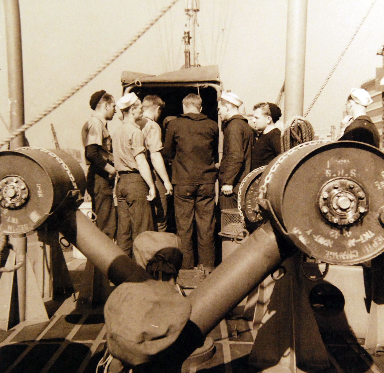 <p>80-G-14954: Battle of the Atlantic: Weapons: K-Gun. Navigating USS PC-556. Depth charges onboard. K-guns propel depth charges to either side of ship. The “ash can” weighs 465 pounds and holds 300 pounds of TNT, October 8, 1942.&nbsp;</p>
