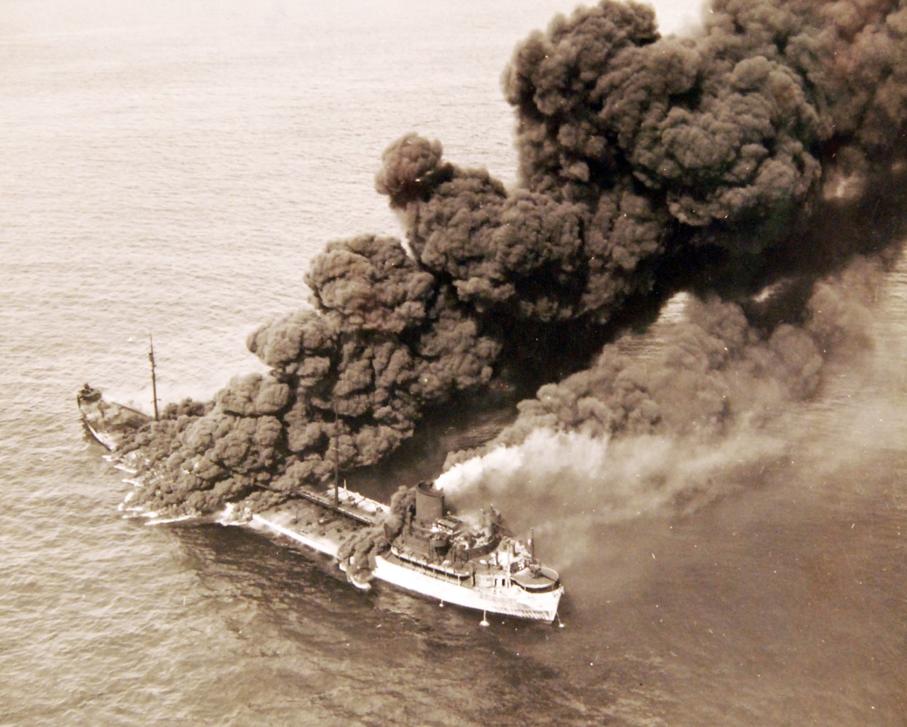 <p>80-G-61599: German U-boat attacks, WWII. SS Pennsylvania Sun burning after being torpedoed amidships by a torpedo by U-571 on July 15, 1942.&nbsp;</p>
