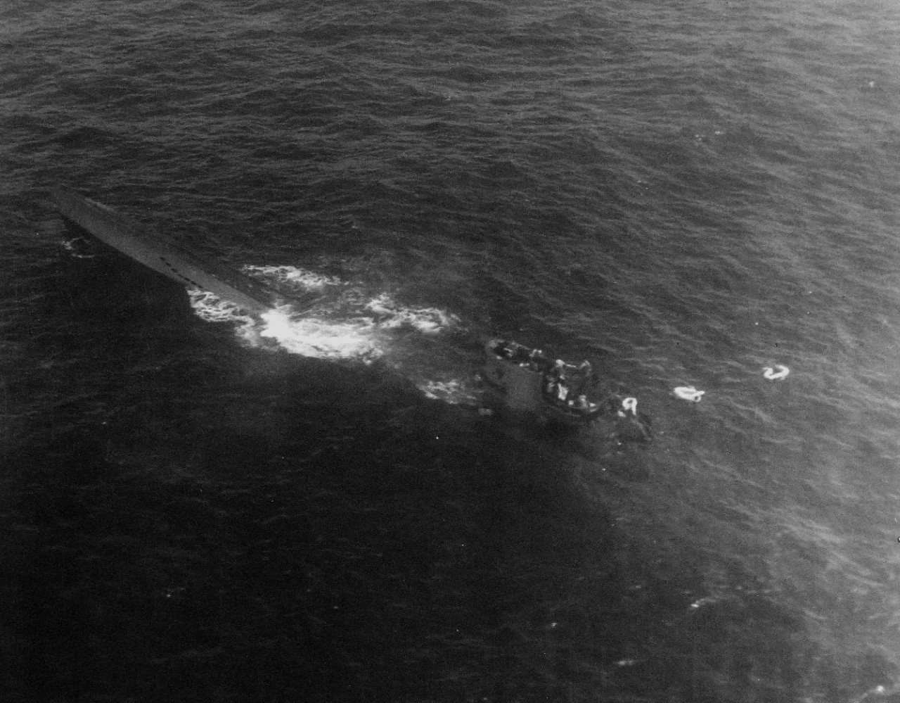 <p>80-G-79410: Air Attacks on German U-boats, WWII. German U-boat incident #3992, August 9, 1943. German submarine, U-664, sinking after an attack by Lieutenant Junior Grade G.G. Hogan, USNR. Forty-four survivors were picked up and taken on board USS Card (CVE-11). This view was taken by another aircraft during the attack, piloted by Lieutenant Junior Grade C.G. Hewitt, USNR.&nbsp;</p>
