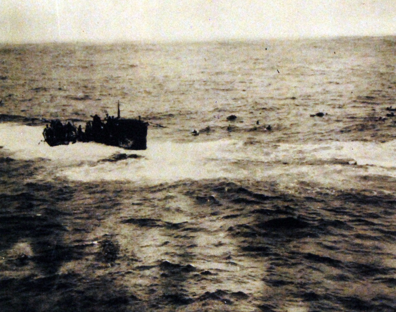 <p>80-G-49786: Rammed depth charged and shelled by USS Gandy (DE 764), USS Joyce (DE 317), and USS Peterson (DE 152), the German submarine U-550 was sunk in April 1944. The crew is shown abandoning the ship. Released April 1944.&nbsp;</p>
