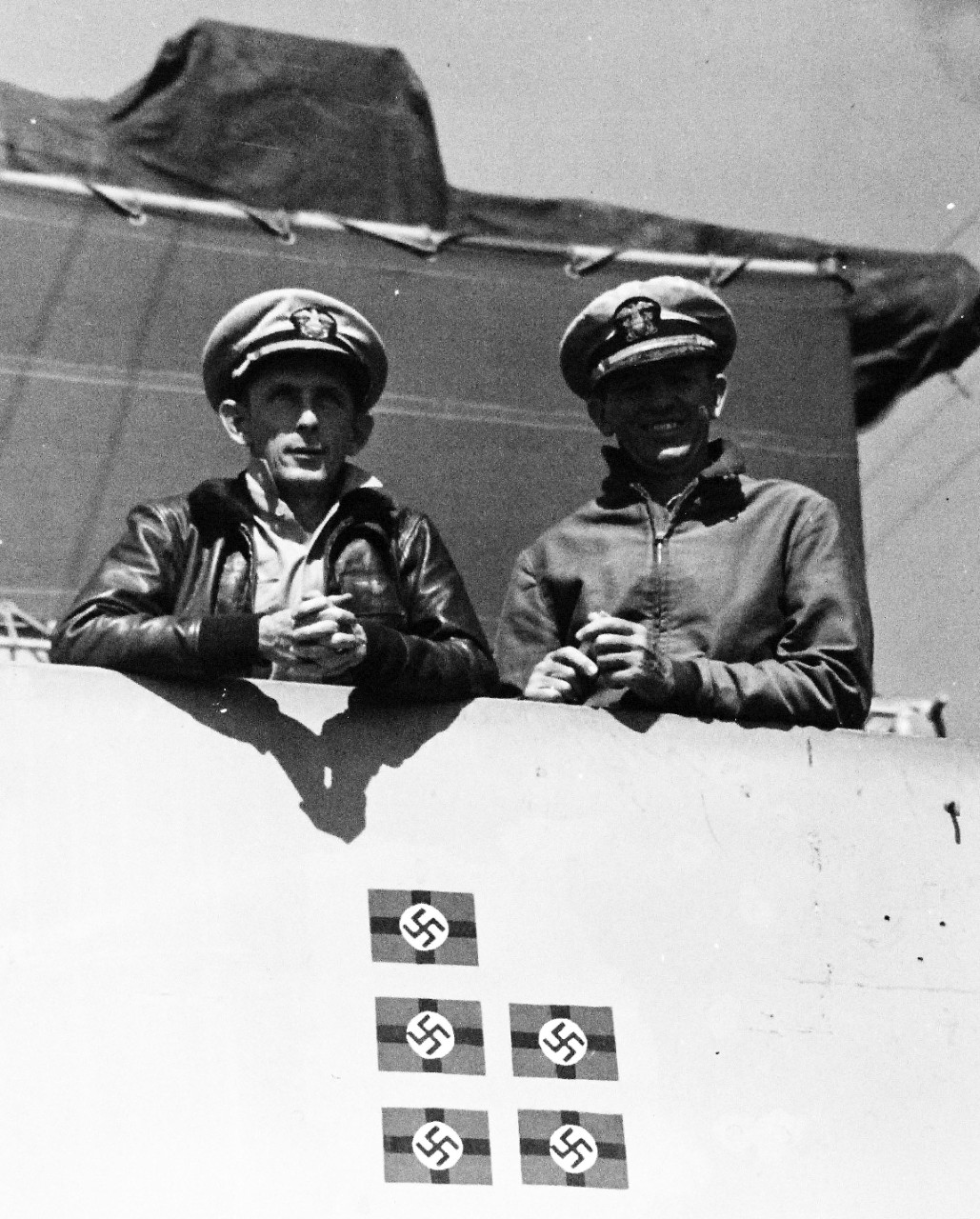 <p>80-G-383997: Capture of German Submarine U-505, June 4, 1944. USS Guadalcanal (CVE 60). Captain Daniel V. Gallery and Commander Johnson shown onboard USS Guadalcanal (CVE 60), July 6, 1944. Note, the five Nazi flags.&nbsp;</p>
