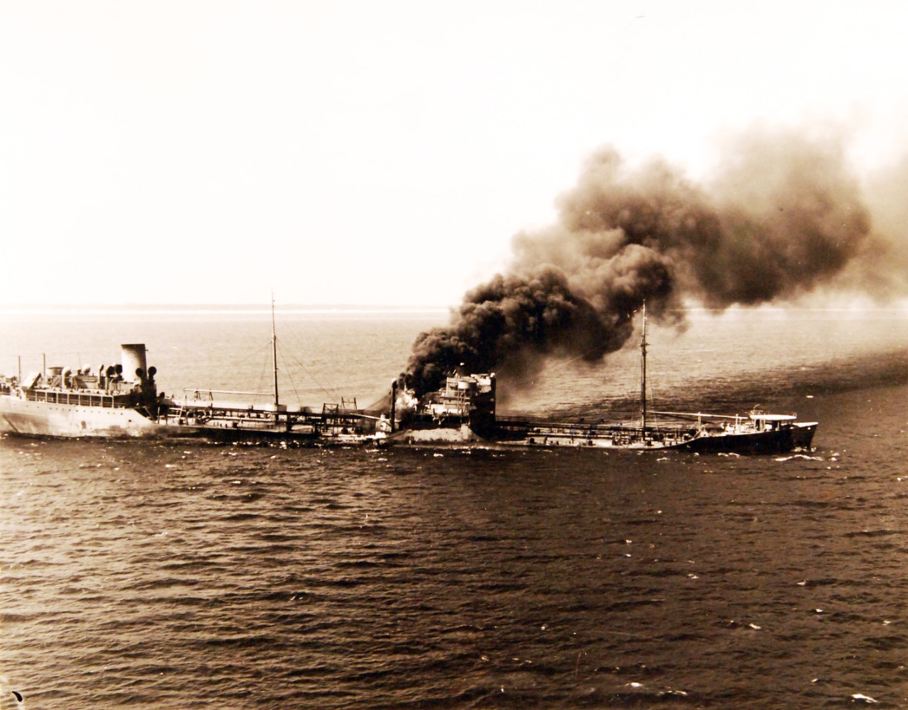 80-G-14047:    German U-boat attacks, 1942.   SS Robert C. Tuttle on fire off Cape Henry after torpedoing starboard side, June 22, 1942.   Tuttle entered into a minefield laid by U-701 off Virginia Beach.    Official U.S. Navy Photograph, now in the collections of the National Archives.  (2017/07/25). 