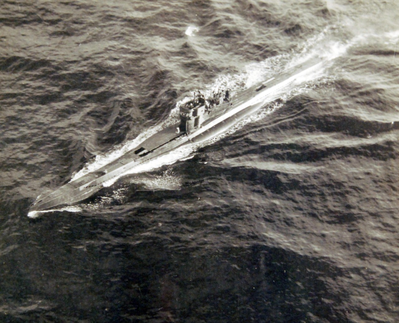 80-G-320285: Surrender of German U-boats, WWII.  U-249 surrendering on May 9, 1945.   U-249 was the first U-boat to surrender after Germany’s surrender.   The submarine surrendered to a PB4Y-1 “Liberator” from FAW-7 off Scilly Islands.  Official U.S. Navy photograph, now in the collections of the National Archives.  (2017/07/18).