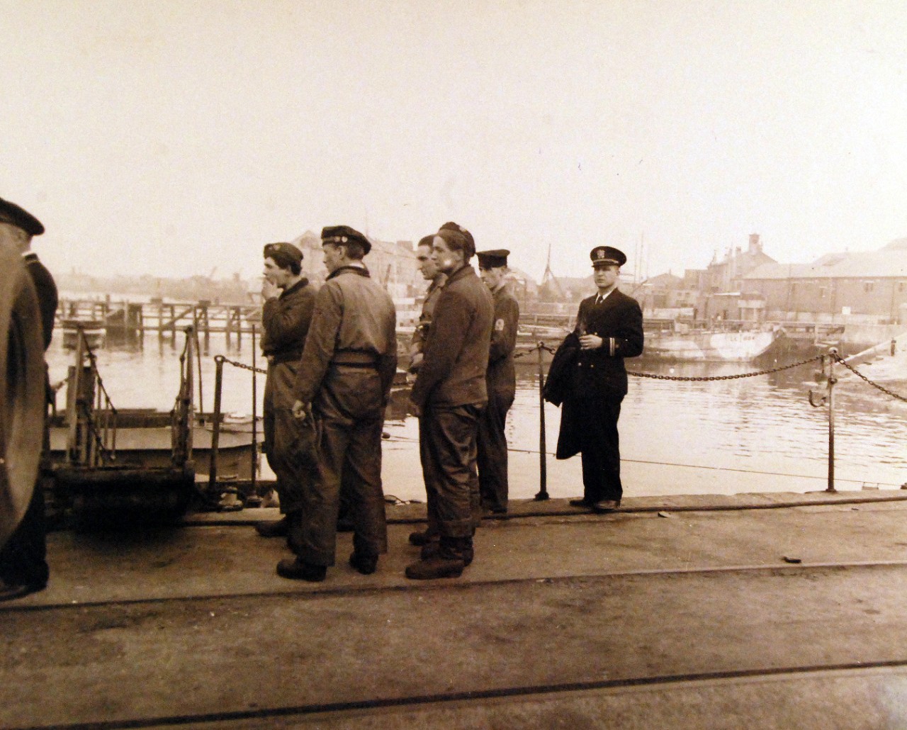 <p>80-G-322625: Surrender of German U-boats, 1945. German submarine, U-249, surrender at Portland, UK, May 10, 1945. Shown: crew of UB prepares to leave their submarine for POW Camp. Commander, Naval Forces, Europe Photograph received May 26, 1945.&nbsp;</p>
