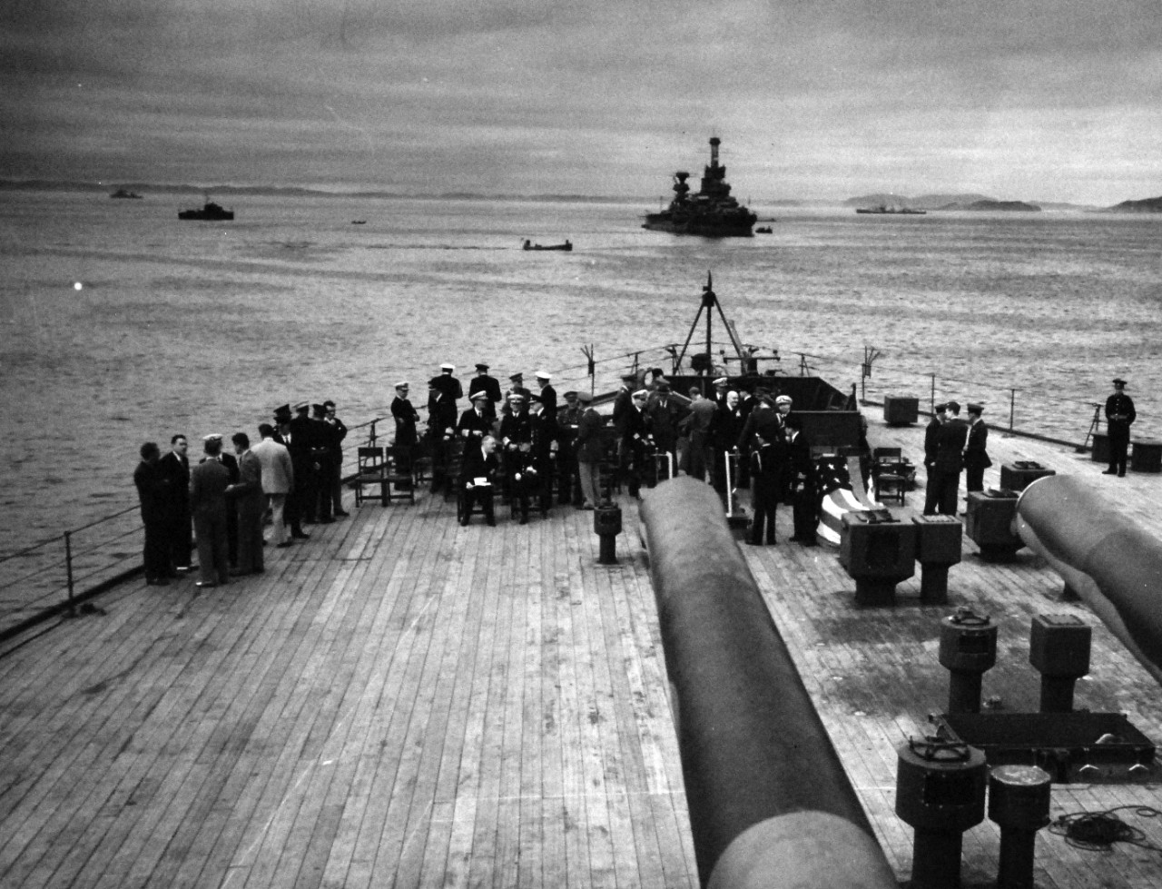 80-G-26879: Atlantic Charter, August 1941.  Informal group photograph including President Franklin D. Roosevelt and Prime Minister Winston S. Churchill on deck of HMS Prince of Wales during church services during the Atlantic Charter.  Photograph released August 1941.   Official U.S. Navy Photograph, now in the collections of the National Archives.  (2016/03/22).