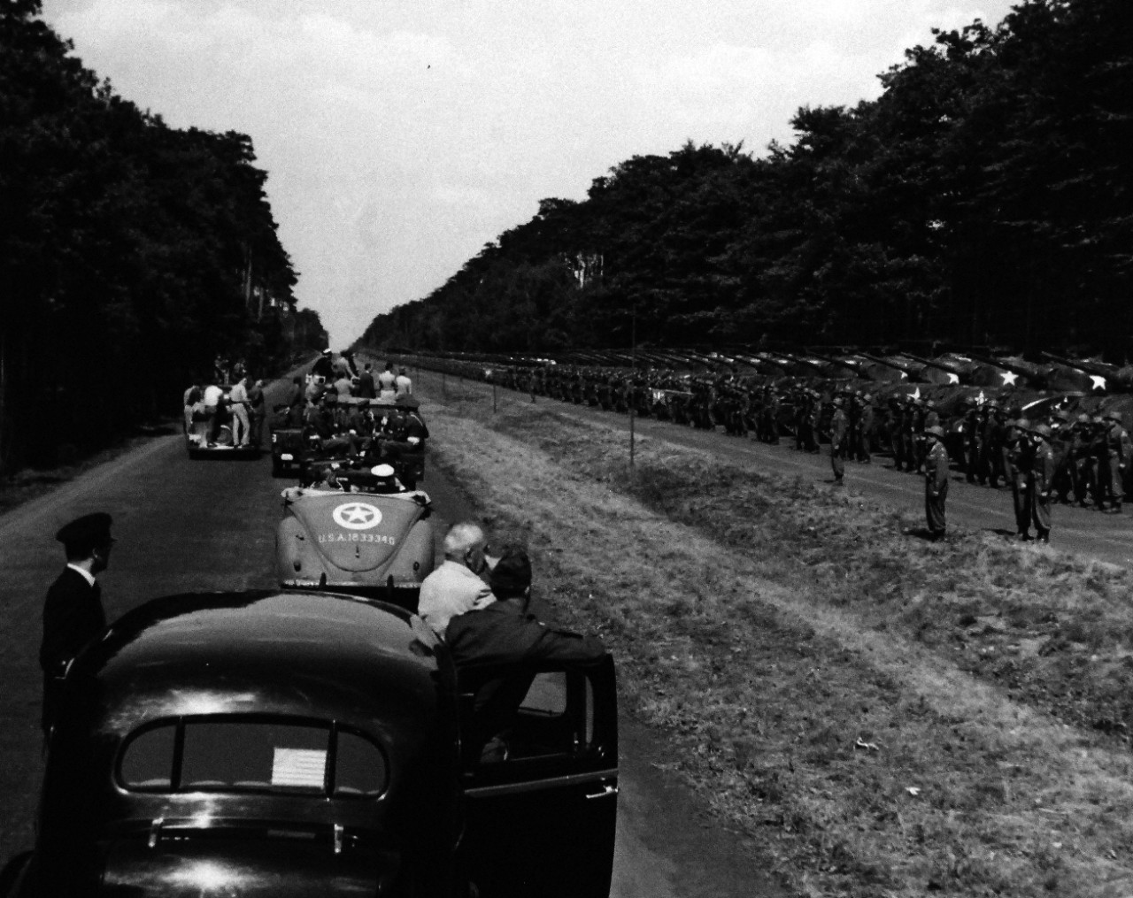 80-G-49985:  Potsdam Conference, July-August 1945.   In between conference sessions, President Harry S. Truman makes a quick tour of Berlin, Germany.   Shown: On the outskirts of the city, he inspects the Second Armored Division.  Shortly following this inspection, he presented the Division with the Presidential Unit Citation.  Photographed by CPhoM Wm. Belknap, received July 16, 1945.  Official U.S. Navy Photograph, now in the collections of the National Archives.  (2016/02/23).