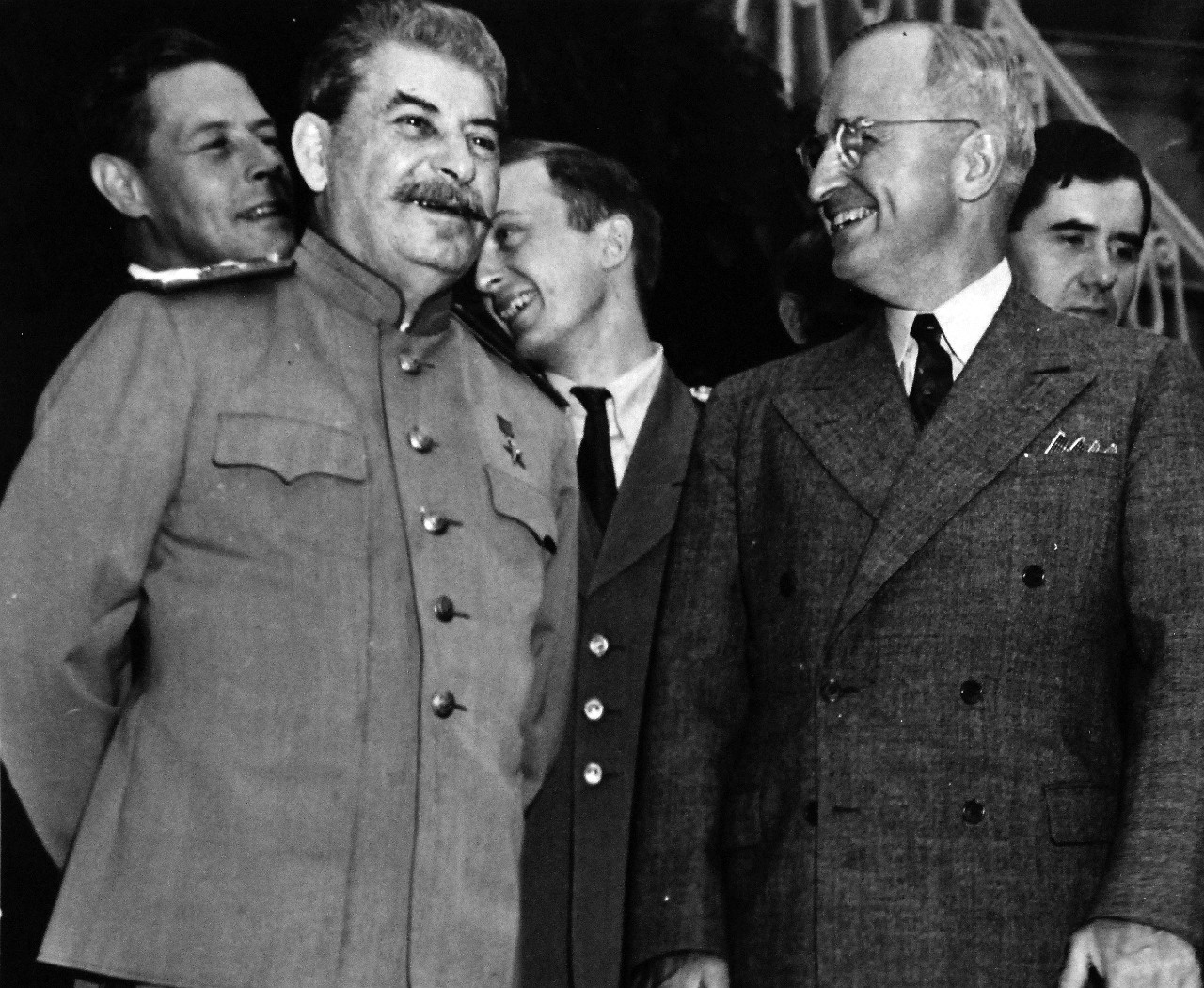 80-G-49989:  Potsdam Conference, July-August 1945.   Between the more serious sessions of the “Big Three” conferences in Berlin, President Harry S. Truman in a visit to Premier Joesph Stalin’s residence inside the conference area, enjoys an amusing incident with mutual reactions.  To the extreme right is Andrei A. Gromyko, Russian Ambassador to the U.S. Photograph received July 24, 1945. Official U.S. Navy Photograph, now in the collections of the National Archives.  (2016/02/23).